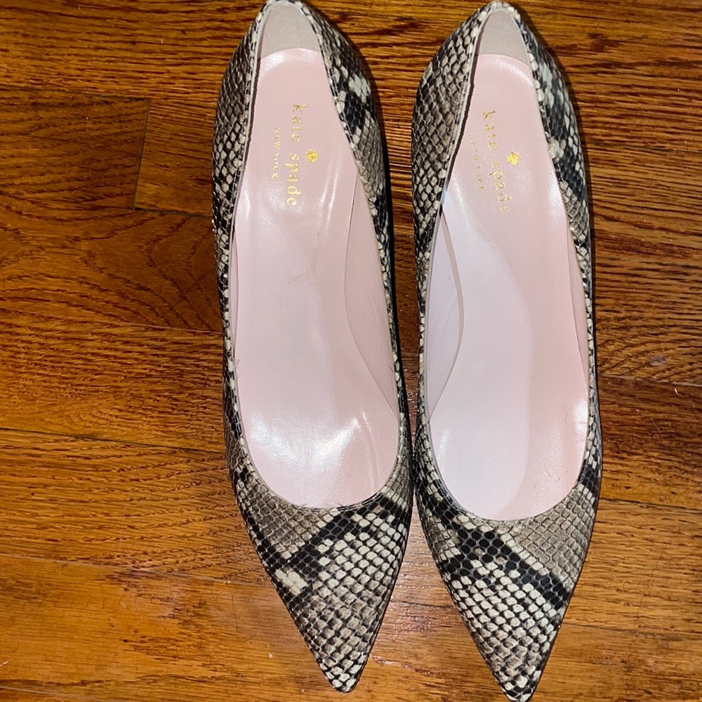 Size 9.5 Kate spade snake skin pumps worn twice in excellent condition.